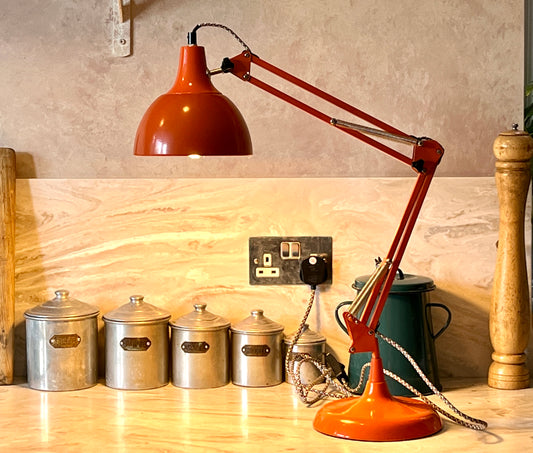 Vintage Orange Anglepoise Lamp in Full working order with a retro looking long mains lead (approx. 194cm)  Classic retro style lighting with an anglepoise that works effortlessly allowing it to be articulated into any position you choose.
