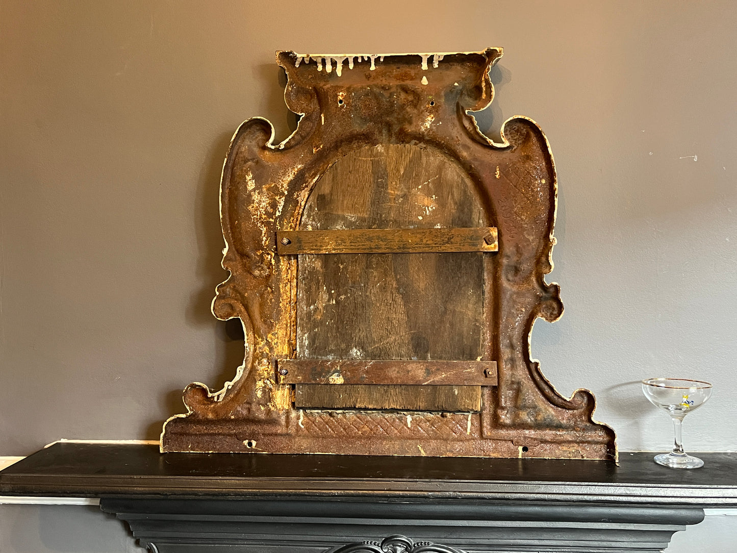 Two Victorian Cast Iron Over Mantle Mirrors. Unique -' one of a kind'  pieces that  would suit a mix of interiors.   These  decorative Over Mantles have been cast from iron with decorative motifs throughout and with the original mirrors in situ.   The blue overmantles' mirror  has been  repaired  using the Japanese Kintsugi method,  which roughly translates as 'joining with gold'